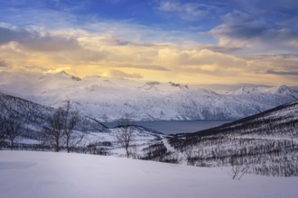 Beautiful winter landscape scene, sunset or sunrise in mountains and fjords
