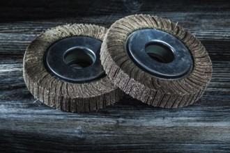 Used abrasive discs on vintage wooden board