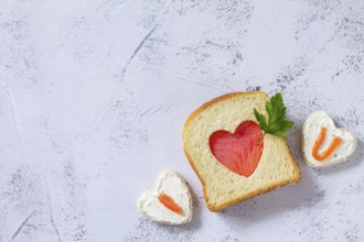 Breakfast for valentine's day or mother's day, toast with salmon and curd cheese with the
