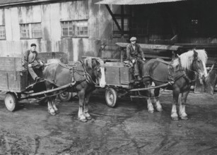 In the 1950s. Two delivery men with their horses. At this time lorries and cars was beginning to