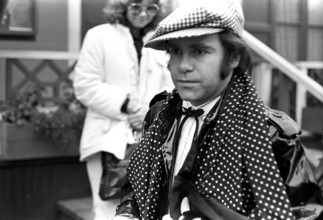 Elton John. English singer, songwriter born march 25 1947. Pictured wearing a chequered cap and a