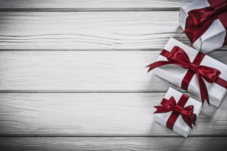 White present boxes on wooden board copyspace holidays concept