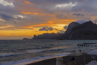 Sunset in the bay of the resort town of Sudak. Crimea