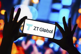 In this photo illustration, the ZT Global logo seen displayed on a smartphone