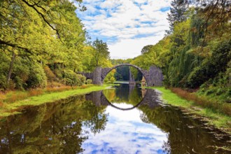 The Devil's Bridge on the Rakots River. Park Kromlau, Germany. The basalt columns of the bridge
