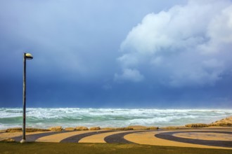 Mediterranean rages. Quay in Tel Aviv in stormy January day