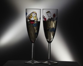 Vintage wedding champagne glasses on black background with crossing lights
