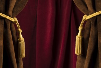 Red theatre curtains and yellow tassels