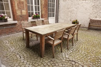 Table and chairs in patio, vintage style
