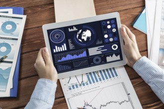 Close-up, the business lady with the tablet. Concept of Finance and Technology