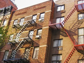 Typical building with fire escapes on the facade in New York City, United States