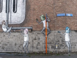 Large wall graffiti on the brick wall of buildings in Craenendonck Street, Leuven, Flemish Brabant