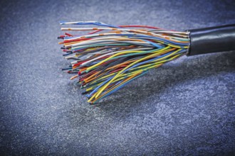 Multicolored electric cables on black background electricity concept
