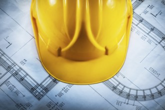 Hard hat on construction drawing top view