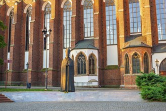 Statue of cardinal in front of the Roman Catholic parish church in Wroclaw, Poland