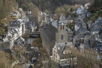 City Monschau in Region national park Eifel in winter with river and church