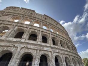 Majestic Colosseum, taken from below with a view of its arches and the sky, Rome, Italy