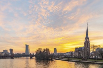 View across the River Main to the ECB and the Protestant Church of the Epiphany. Sunrise in the