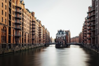 Long exposure view of the Warehouse District or Speicherstadt. Wandrahmsfleet canal. UNESCO World