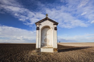 A small chapel in the middle of autumn fields