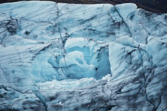 Detailed close-up of blue glacier ice with textured patterns, iceberg, glacier, snow, ice rock, ice