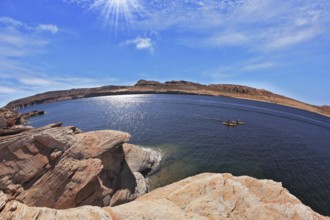 The midday sun in the turquoise water bay. Bottling magnificent Lake Powell photographed by Fisheye