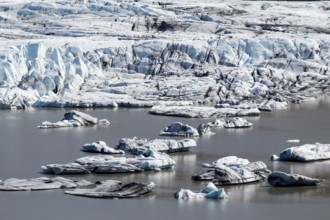 Close-up of Skaftafell glacial tongue, small icebergs in the lake, Iceland