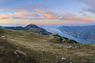 Panorama on top of Monte Altissimo at dusk with lake garda