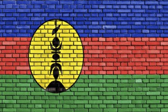Flag of New Caledonia painted on brick wall