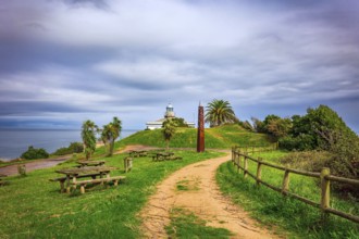 The road to the lighthouse. The picturesque seaside fishing town of Candas. Atlantic coast, Spain.