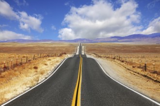 Excellent highway in California. Steppe and clouds