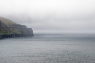 Rocky landscape on the Faroe Islands with cliff and ocean, Eidi, Faroe Islands, Denmark