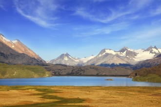 A blue lake in a picturesque valley surrounded by snow-capped mountains. National Park Perito