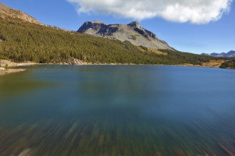A deep blue lake on a high mountain pass