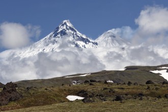 Beautiful mountain landscape of Kamchatka Peninsula: view on Kamen Volcano and active Klyuchevskoy