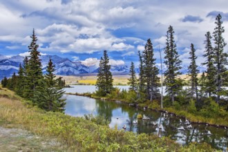 The valley along the Pocahontas road. Shallow-water lakes, picturesque firs and distant mountains.