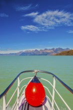 Unique lake Viedma in Argentine Patagonia. The lake is surrounded by mountains. Big boat for