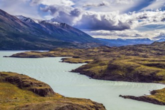 Azure lake Pehoe between rocks Los Kuernos. National Park Torres del Paine. Travel in Chile. The