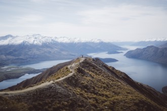 Mountain peak with a path looking down onto a frozen lake, Roys Peak, Wanaka, New Zealand