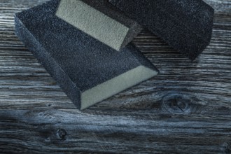 Sanding sponges on vintage wooden board top view