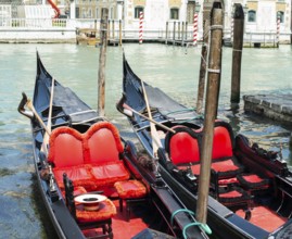 Ancient gondolas boat in Venice. Gondola red color interior