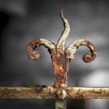 Forging railing to shape flame, vintage detail. Shallow depth of field. Defocused blurry background