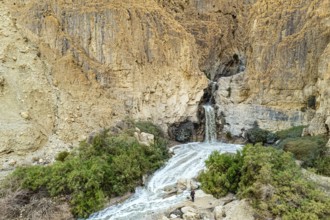 The famous biblical stream Kidron. Winter flood on the Kidron stream. Ancient mountains around the