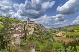 View of Saint-Cirq-Lapopie village with catholic church, France