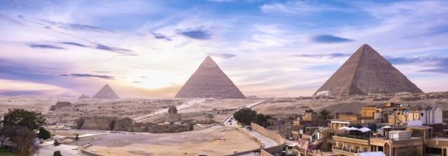 Panoramic view of pyramids and Shinx Cairo at sunset