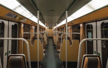 Anderlecht, Brussels Capital Region, Belgium, 03 31 2020 Almost empty orange interior of a metro