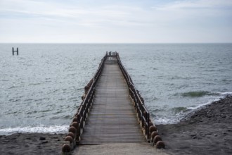 Wooden breakwater on the beach
