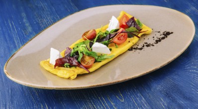 food still-life, Omelette with cherry tomatoes and goat cheese