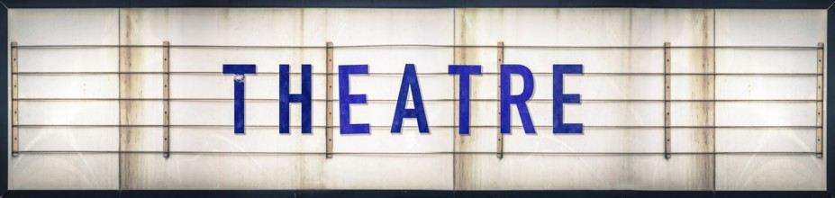 A Grungy Old Weathered Theatre Marquee Sign With Blue Letters