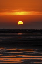Beautiful golden coloured sunset at the seaside on the Isle Borkum
